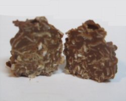 An opened coconut cluster